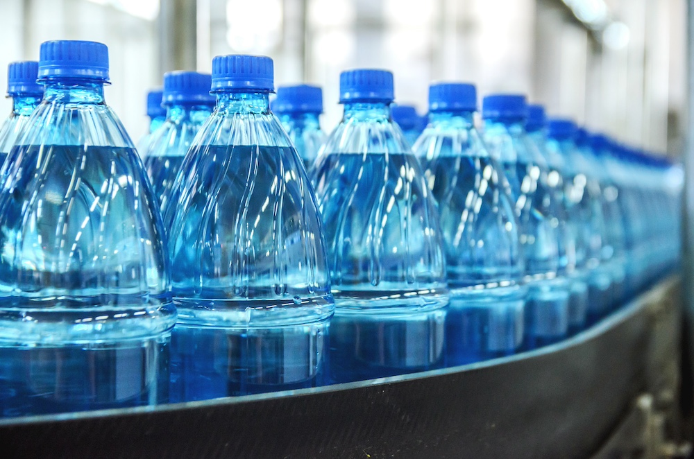 Mineral water getting packaged with the help of a CPG brand consultant